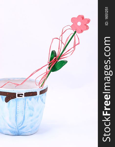 Wooden flower in flowerpot isolated on white background