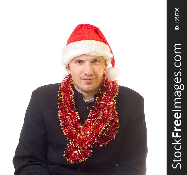 A man dressed in suit, xmas hat and tinsel; over white background. A man dressed in suit, xmas hat and tinsel; over white background