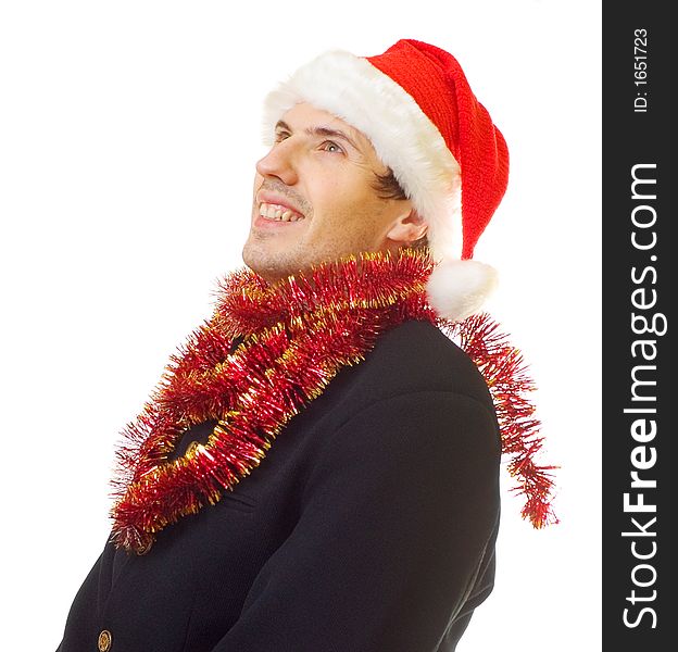 A man dressed in suit, xmas hat and tinsel; over white background. A man dressed in suit, xmas hat and tinsel; over white background