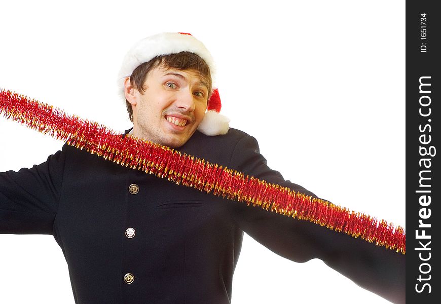 A man dressed in suit, xmas hat stretch the tinsel; over white background. A man dressed in suit, xmas hat stretch the tinsel; over white background