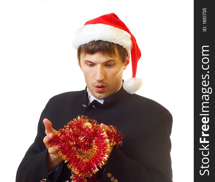 A man dressed in suit, xmas hat with tinsel and bells is very surprised; over white background. A man dressed in suit, xmas hat with tinsel and bells is very surprised; over white background