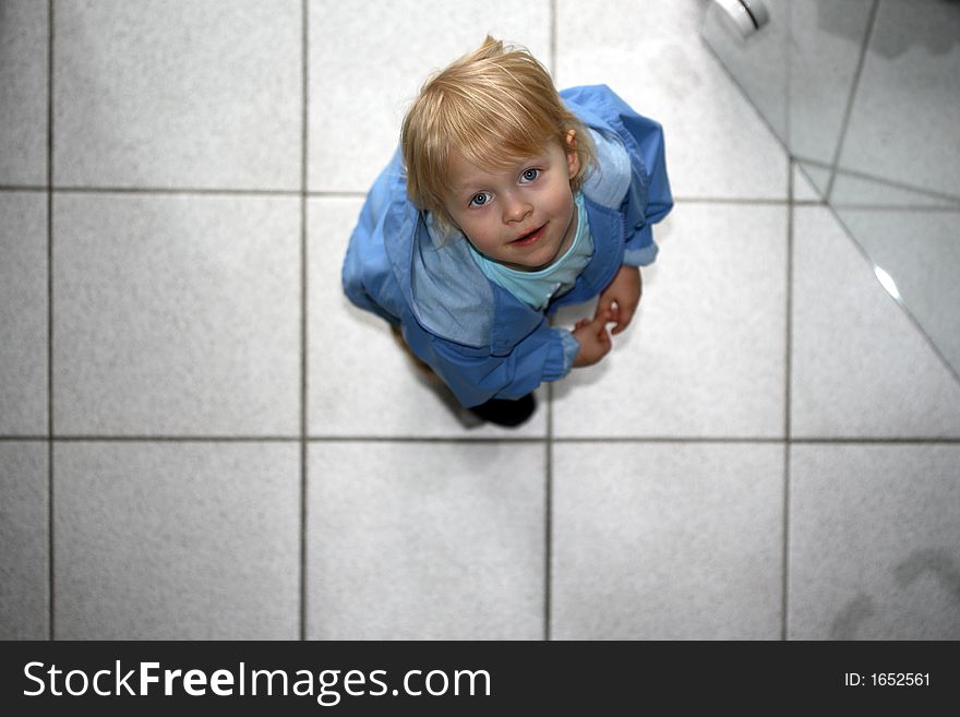 A little girl standing upturned