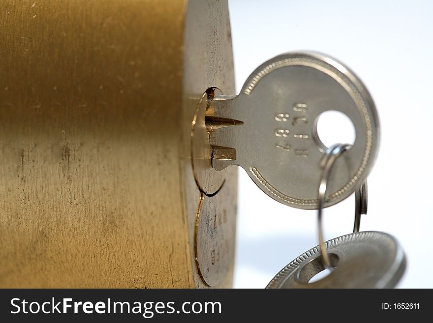 Padlock with key and white background