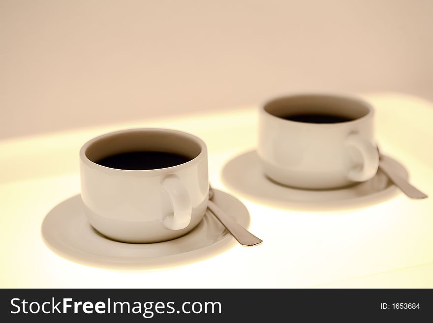 2 white cups of coffee