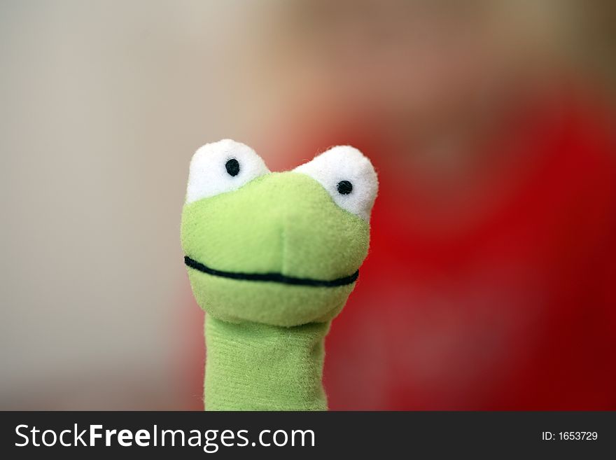 A green frog as a toy for children