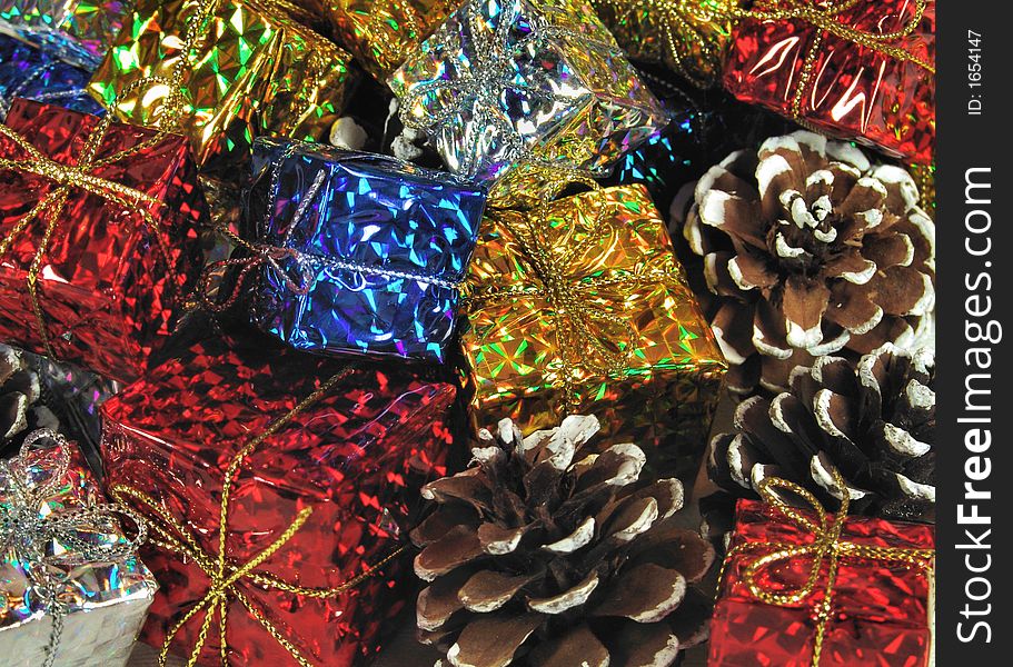 Bright shiney psychedelic Christmas gifts and pinecone decorations.