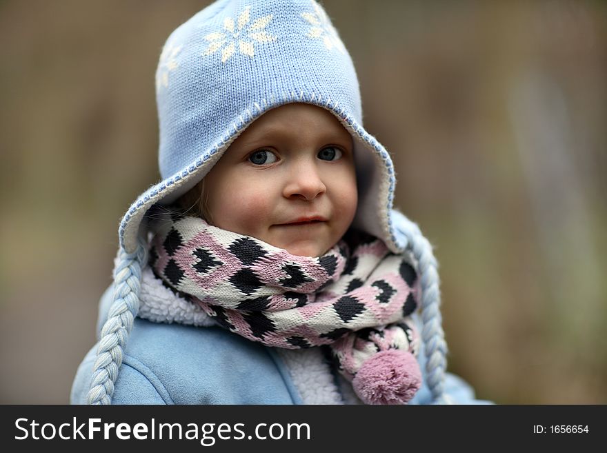 A little girl in cold winter