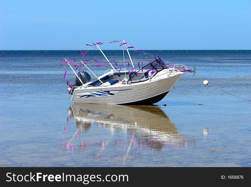 Fishing boat with pink decorations. Fishing boat with pink decorations