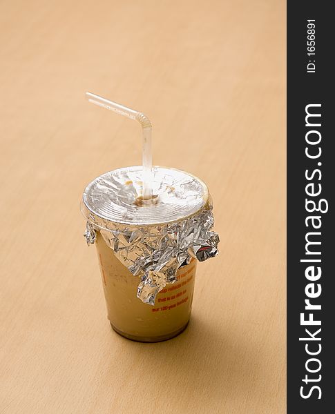 Close up of a Cold Coffee cup with straw