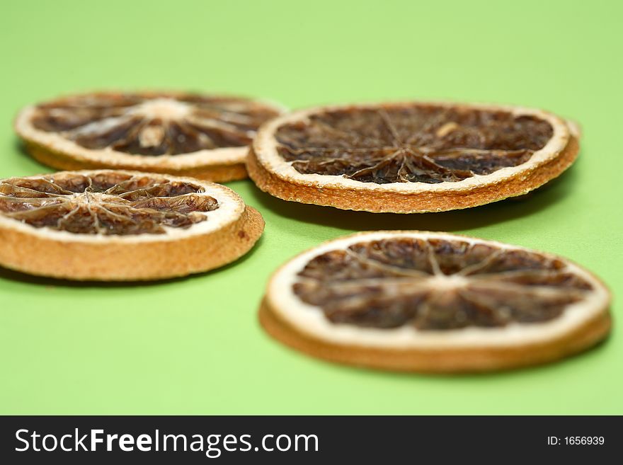 Some dried oranges and a green background