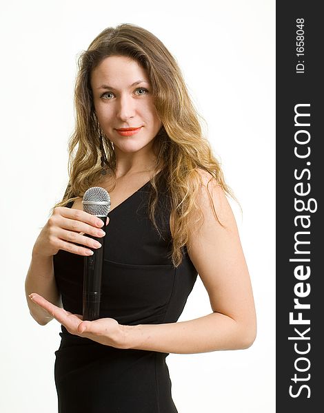 Pretty singer. Woman with microphone on white background.