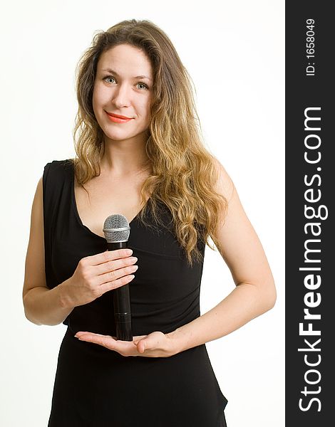 Pretty singer. Woman with microphone on white background.