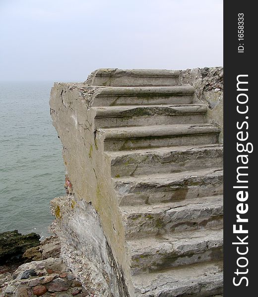 Old cement stairs by the sea in Liepaja (Latvia) - ruins of old forts. Old cement stairs by the sea in Liepaja (Latvia) - ruins of old forts