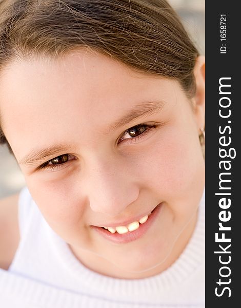 Little girl with brown long hair, being happy and smiling. Little girl with brown long hair, being happy and smiling