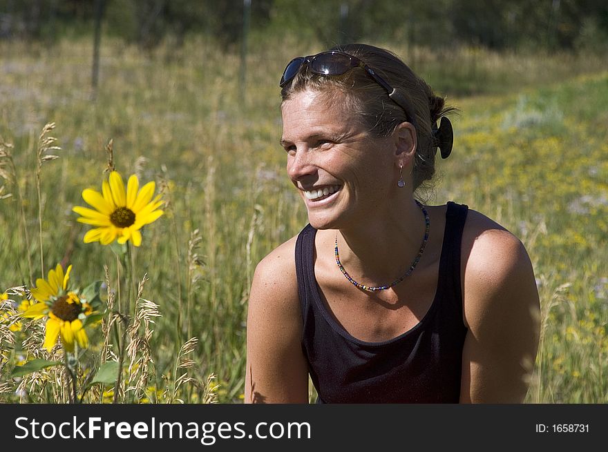 Woman in a field of prairie sunflowers outside of Cuchara in the Spanish Peaks of Colorado. Woman in a field of prairie sunflowers outside of Cuchara in the Spanish Peaks of Colorado.