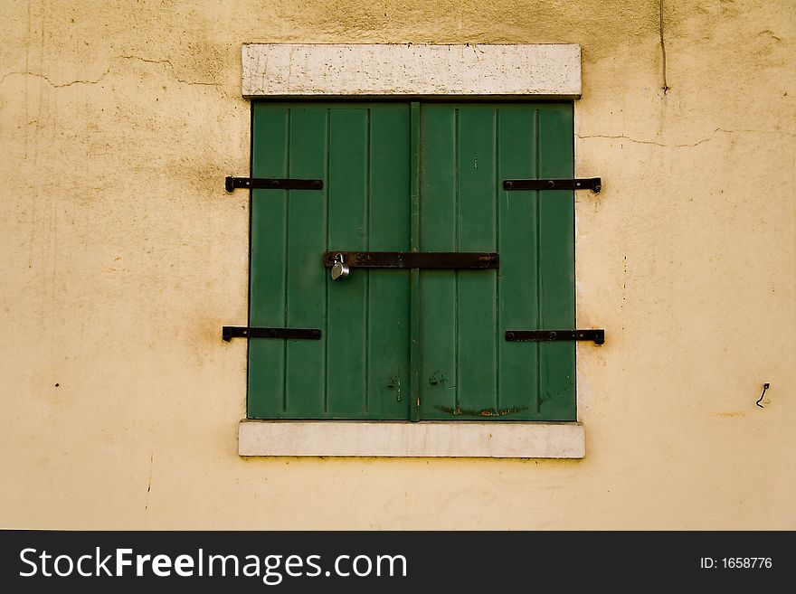 A shot of green storm doors on a warehouse in Charlotte Amalie on the island of St. Thomas in the United States Virgin islands.