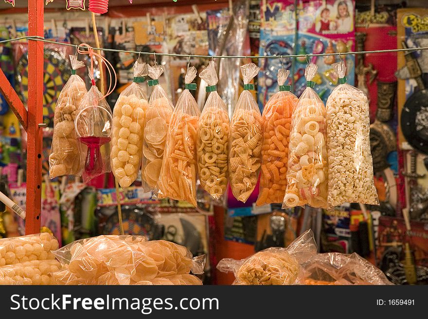 Bags of colorful snacks in a market