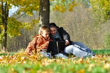 Kid And Woman With Notebook Stock Photography Kid And Woman With Notebook Stock Photography