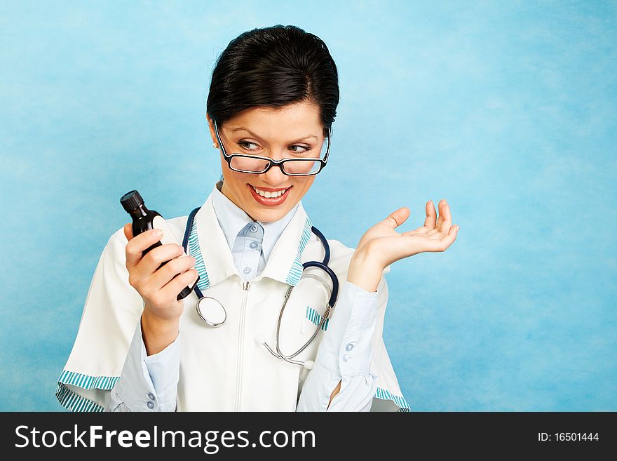 Adult caucasian woman as a doctor holding meds