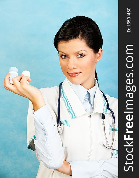 Adult caucasian woman as a doctor holding meds