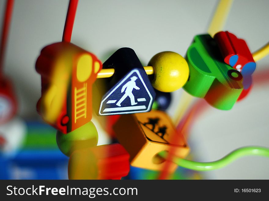 Toy pedestrian crossing road sign with blue background