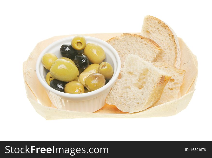 Olives and chunks of bread in a wooden basket. Olives and chunks of bread in a wooden basket