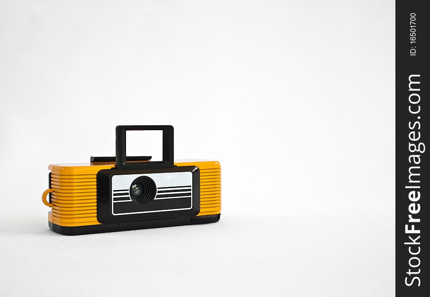 Yellow vintage classic camera isolate on background