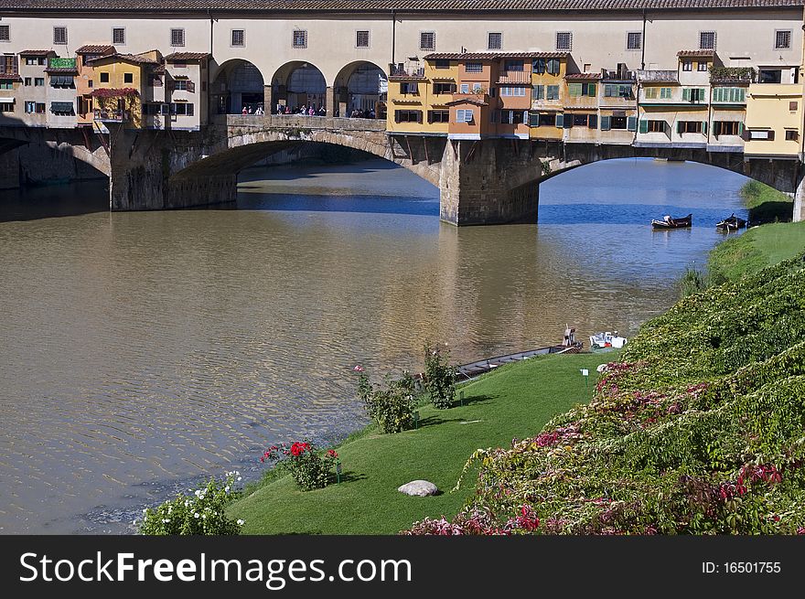 The Ponte Vecchio is a Medieval bridge over the Arno River, in Florence, Italy, noted for still having shops built along it, as was once common.