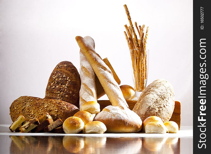 Group of different bread products photographed with light brush