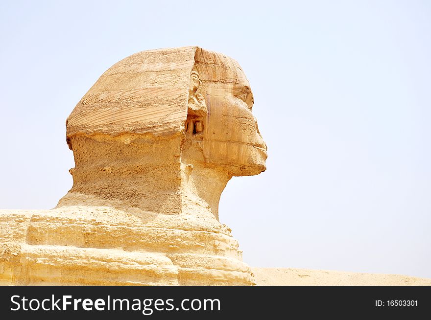 Close-up view of the famous Sphynx in front the giant pyramid,Egypt.