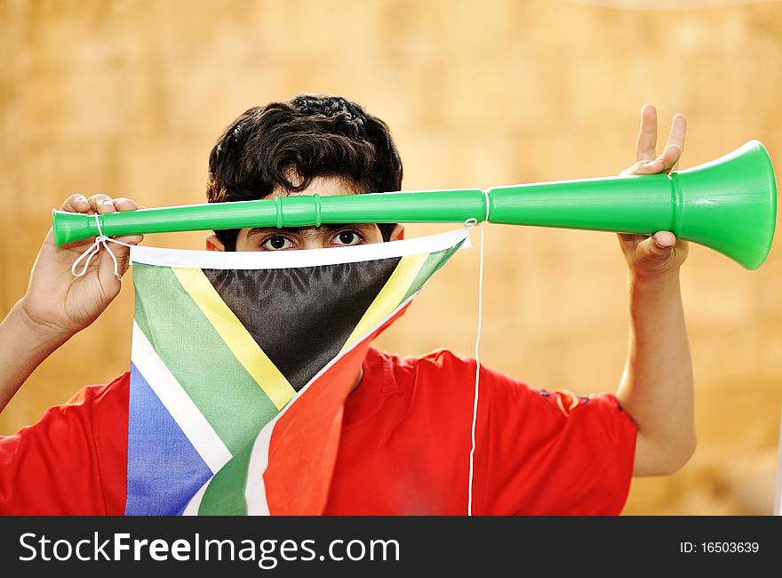 Encourager with vuvuzela and flag