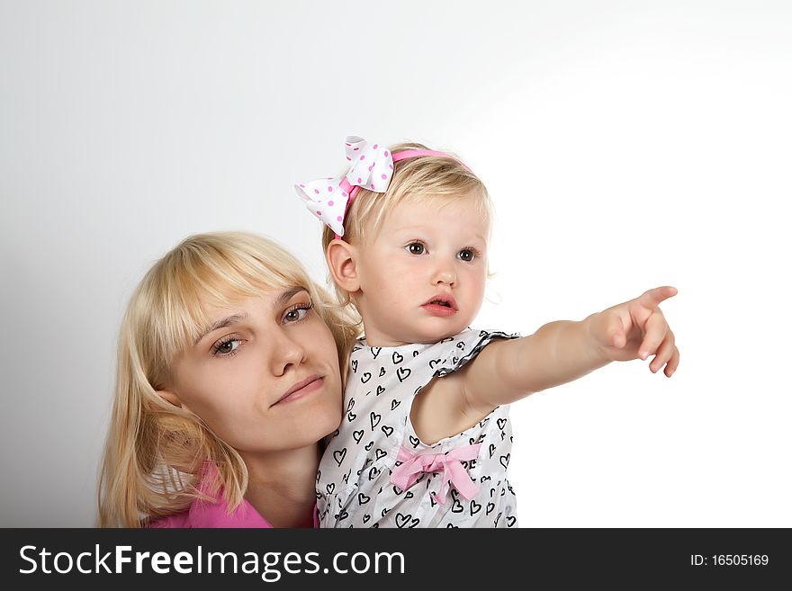 Beautiful child girl playing with toys and her mother. Beautiful child girl playing with toys and her mother