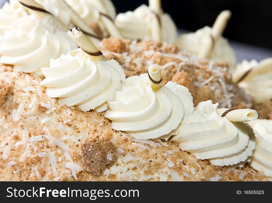 Coconut flakes and whipped cream cake. Coconut flakes and whipped cream cake