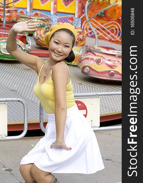 Happy girl walking in amusement park