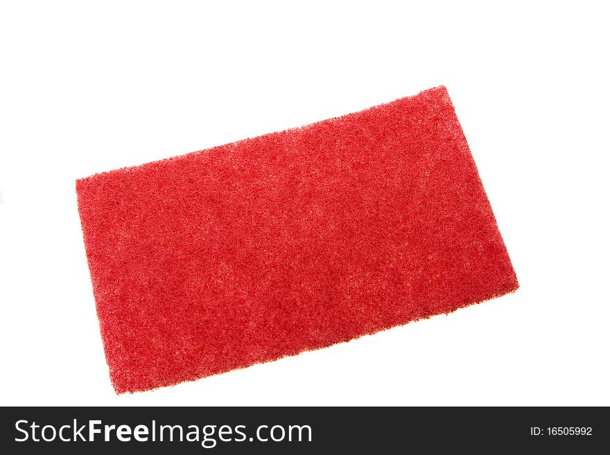 Red sponge from the rigid material, intended for cleaning