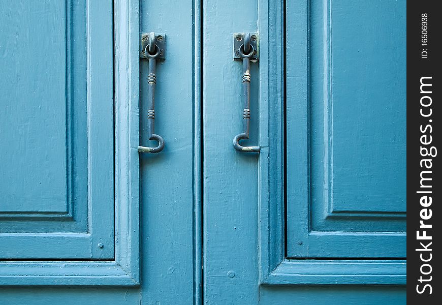 Pair of window hook on Blue wood window