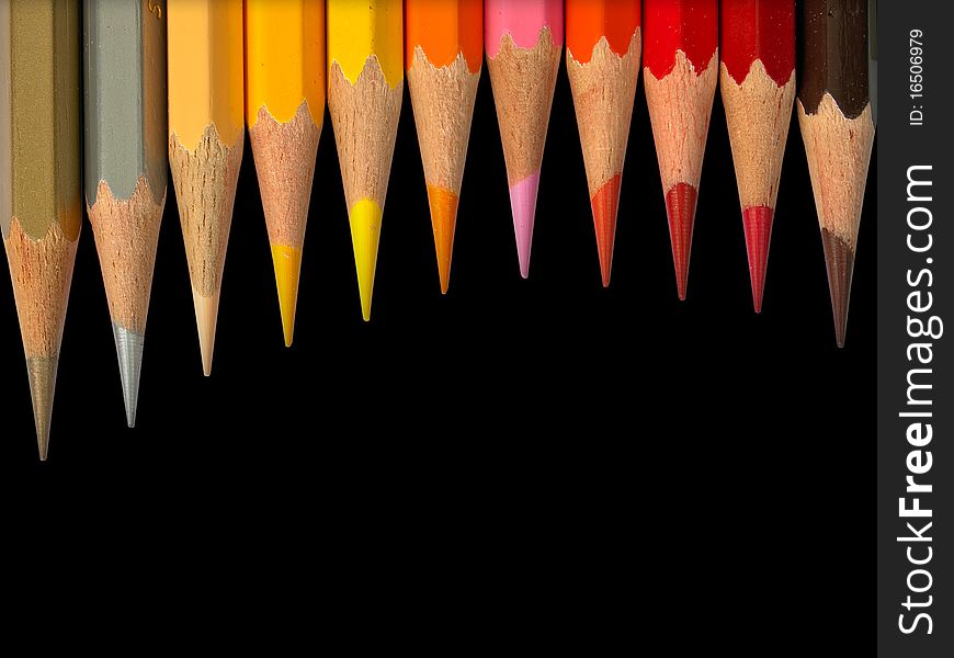 Eleven hot tone color pencil on black background