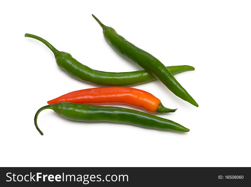 Green and orange chili pepper on white background. Green and orange chili pepper on white background
