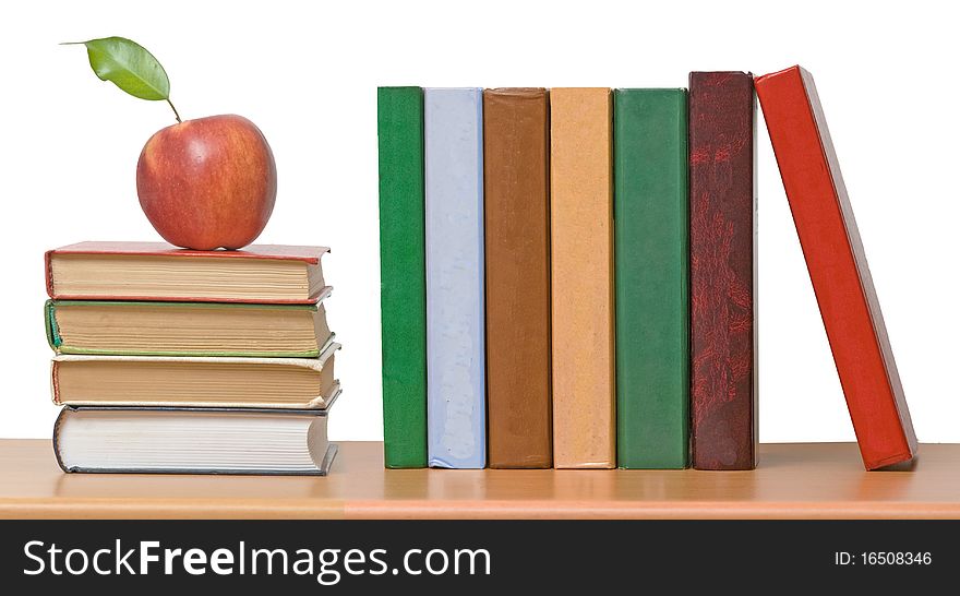 Red apples and row of book. Red apples and row of book