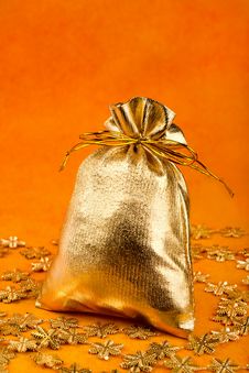 Golden Gift Sack And Golden Snowflakes Royalty Free Stock Photography Golden Gift Sack And Golden Snowflakes Royalty Free Stock Photography