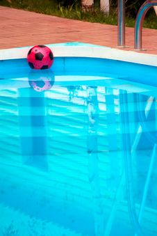 Ball Is Floating In Pool Near House Stock Photography