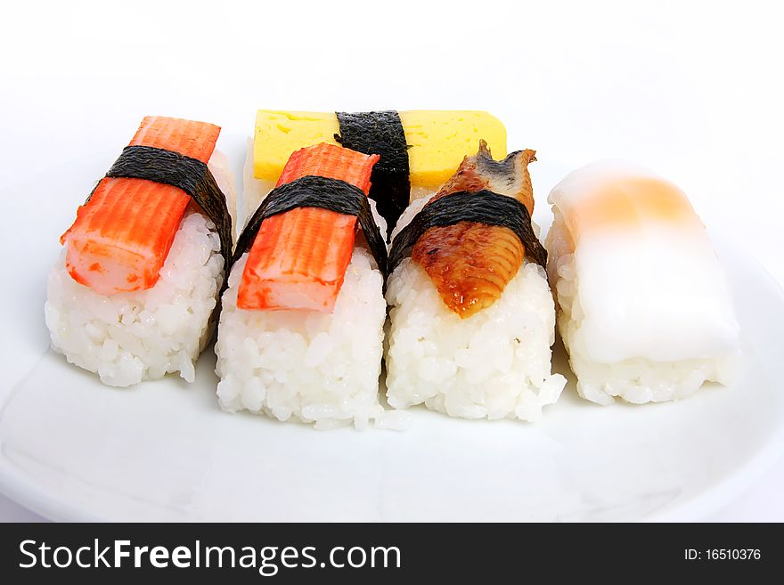 Various types of japanese sushi on plate. Various types of japanese sushi on plate