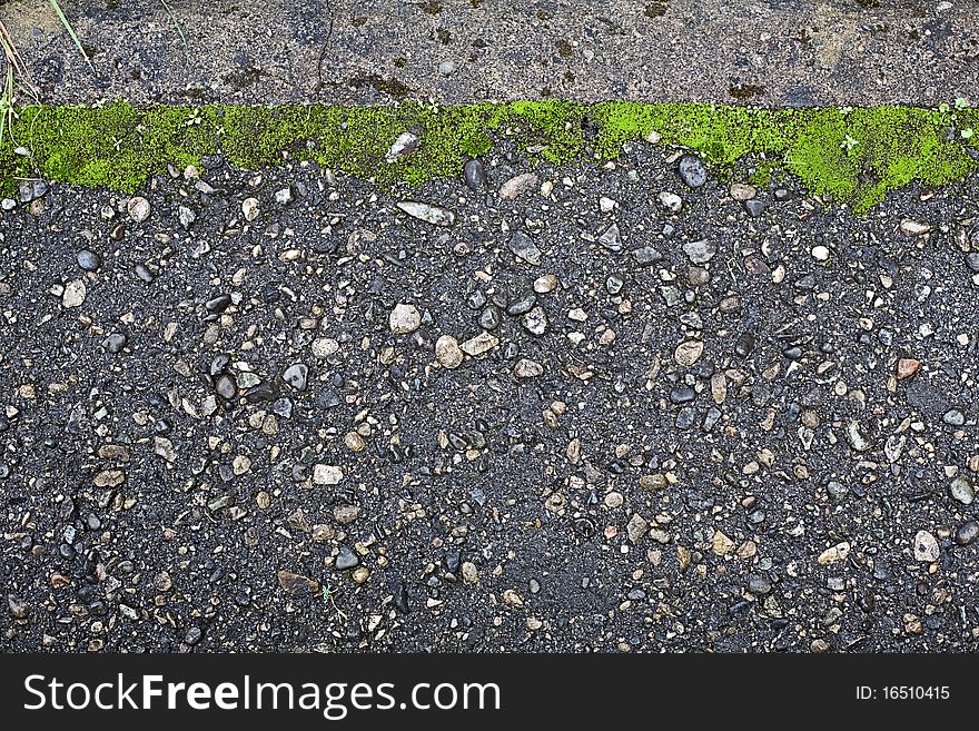 Background from old asphalt with grass