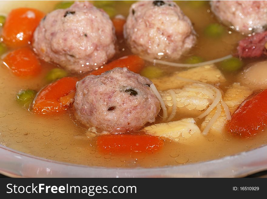 Fine noodle soup with meatballs.