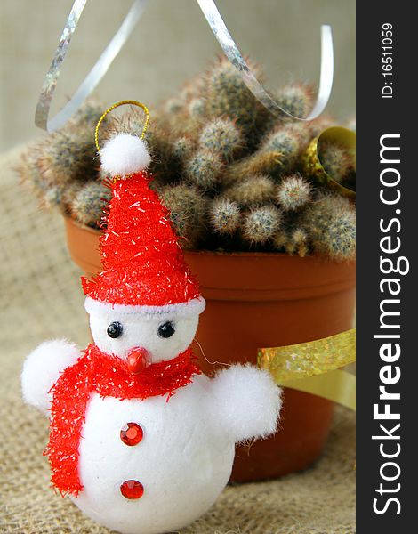 Cactus decorated with Christmas toys and snowman