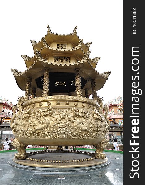 Huge golden incense burner in chinese temple.