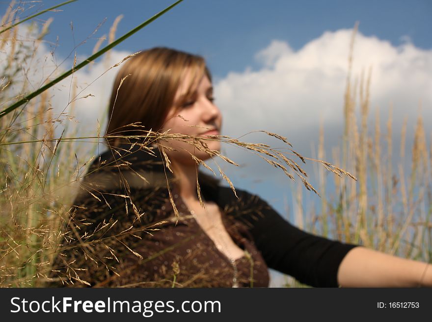 Young woman in the grass