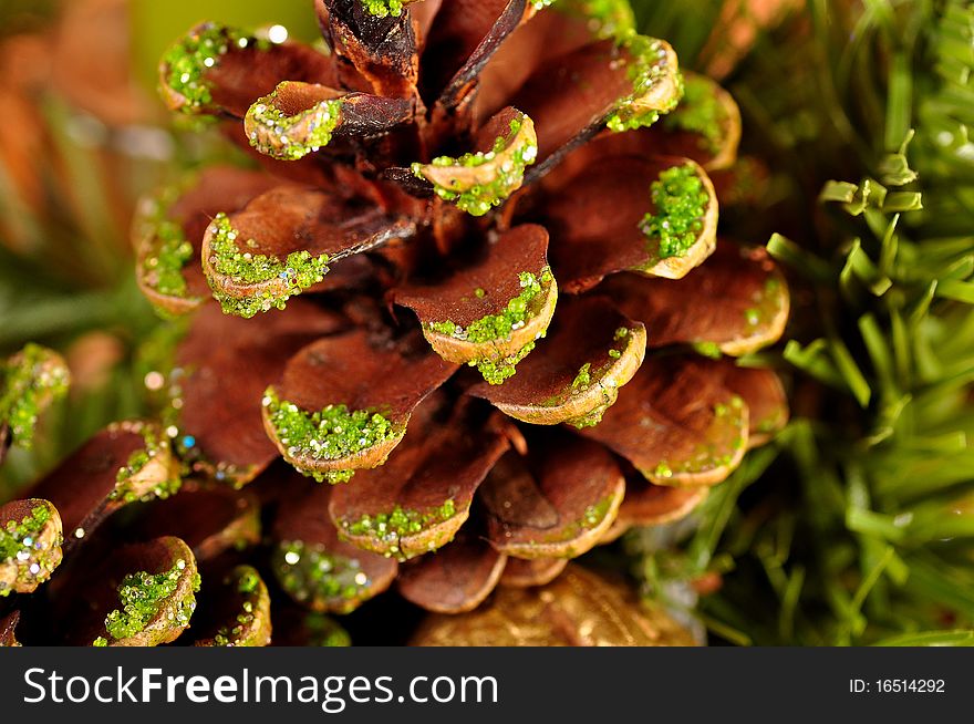 Photo of Christnas cones and candle.