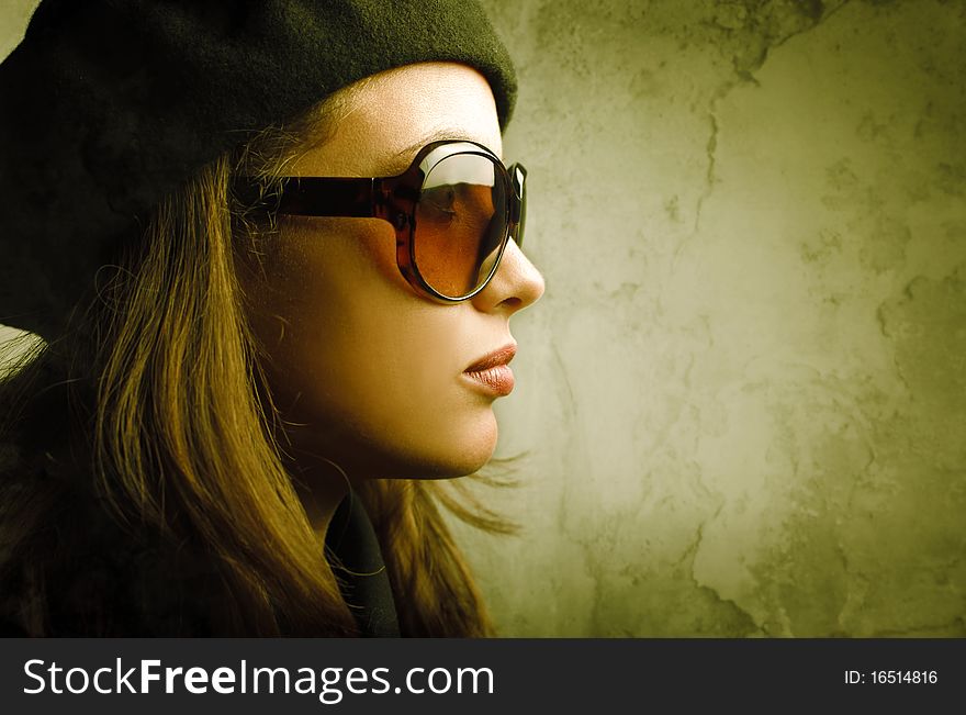 Profile of a beautiful woman wearing sunglasses. Profile of a beautiful woman wearing sunglasses