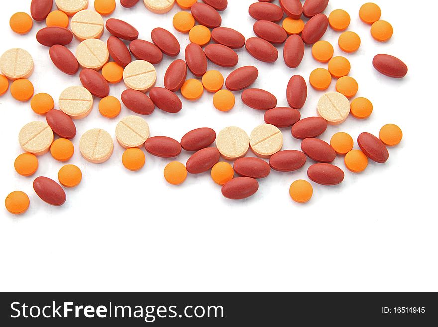 Orange Red And Pink Pills Isolated On White